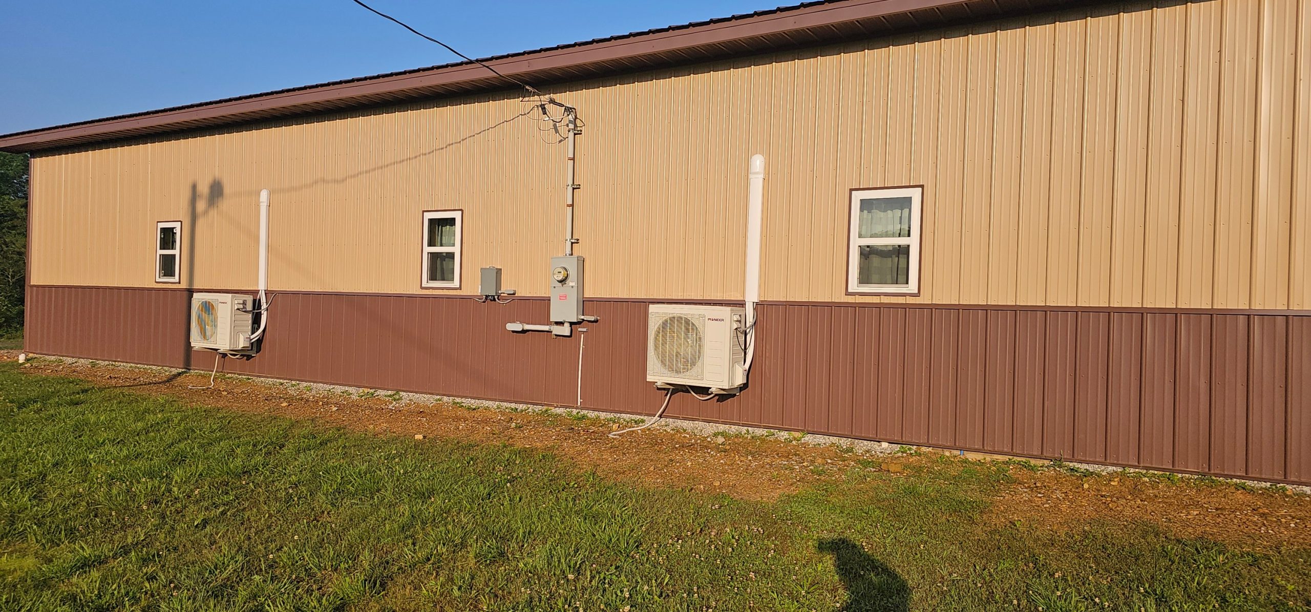 Several outdoor condensers are mounted along the side of a commercial building in Sparta, TN — Kilgore Heating and Air