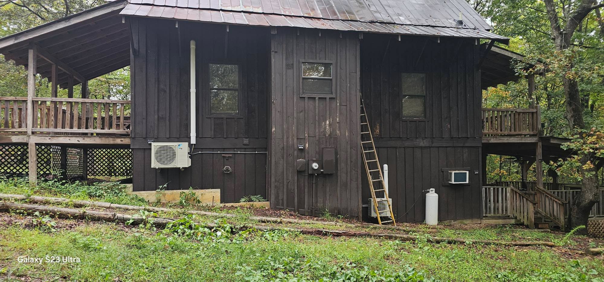 A compact outdoor mini-split condenser is mounted beside a small cabin — diagnosing an AC that will not turn on