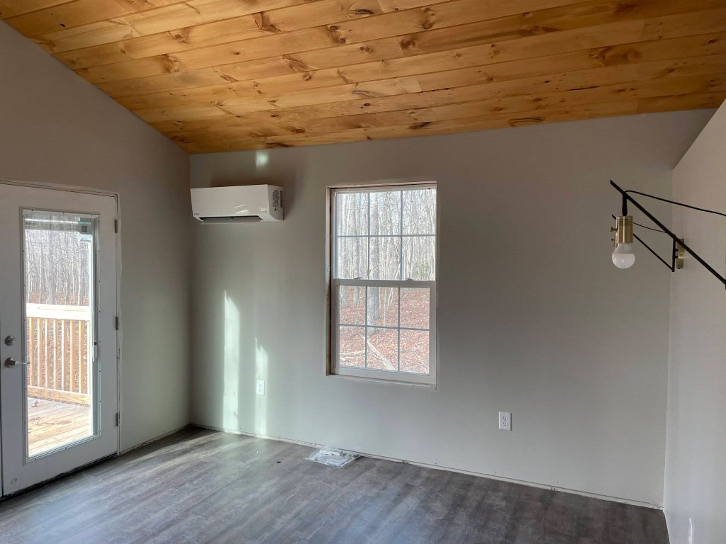 Ductless mini-split installed beside patio doors in a Sequatchie Valley home