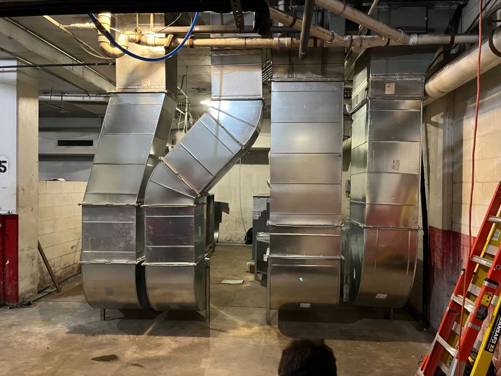 Custom commercial duct risers in a mechanical room