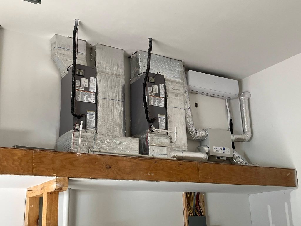 Dual air handlers with a mini-split indoor head