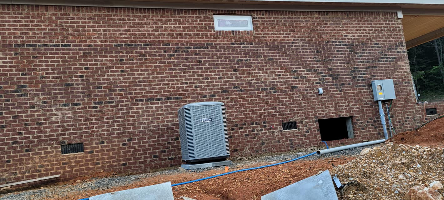 Outdoor condenser installed beside a new brick Sequatchie Valley home