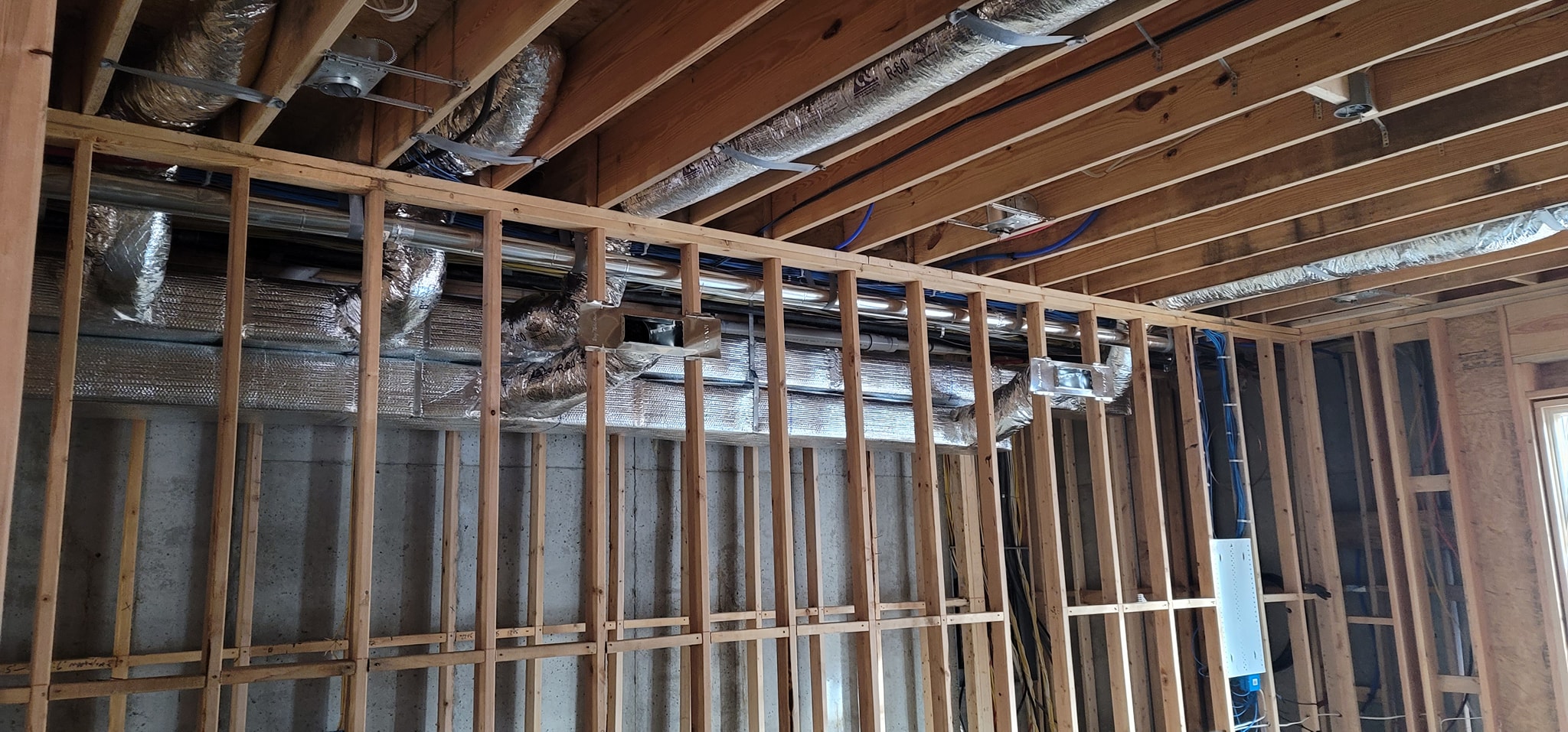 Reflective insulated ductwork is installed above a framed basement wall layout — diagnosing a furnace that will not ignite