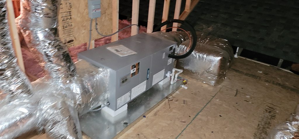 Horizontal air handler connected to insulated ducts in attic