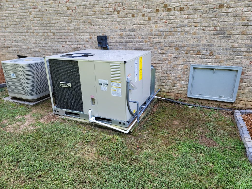 Kilgore Heating and Air install: outdoor package unit and separate condenser at a brick home in the Sequatchie Valley