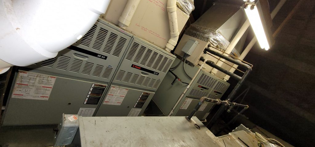 Two furnaces installed in indoor mechanical room project photo