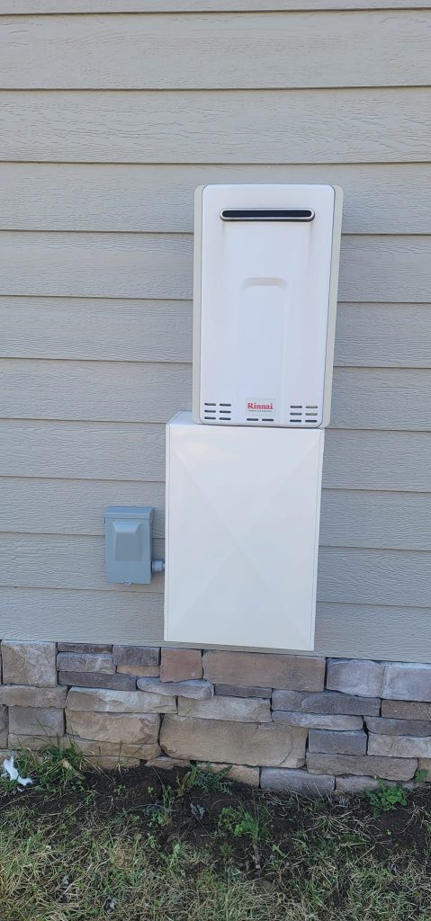 Rinnai tankless water heater mounted on an exterior home wall