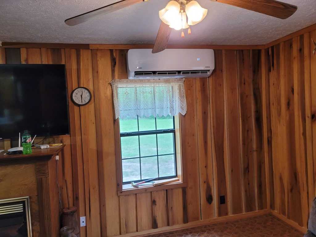 Mini-split installed in a wood-paneled room