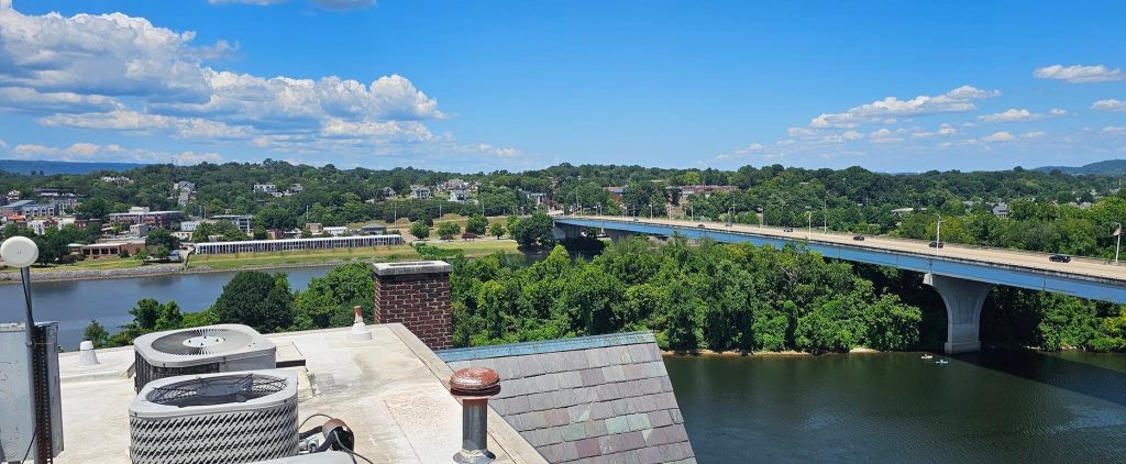 Commercial rooftop condensers overlooking a Tennessee river near Chattanooga metro businesses