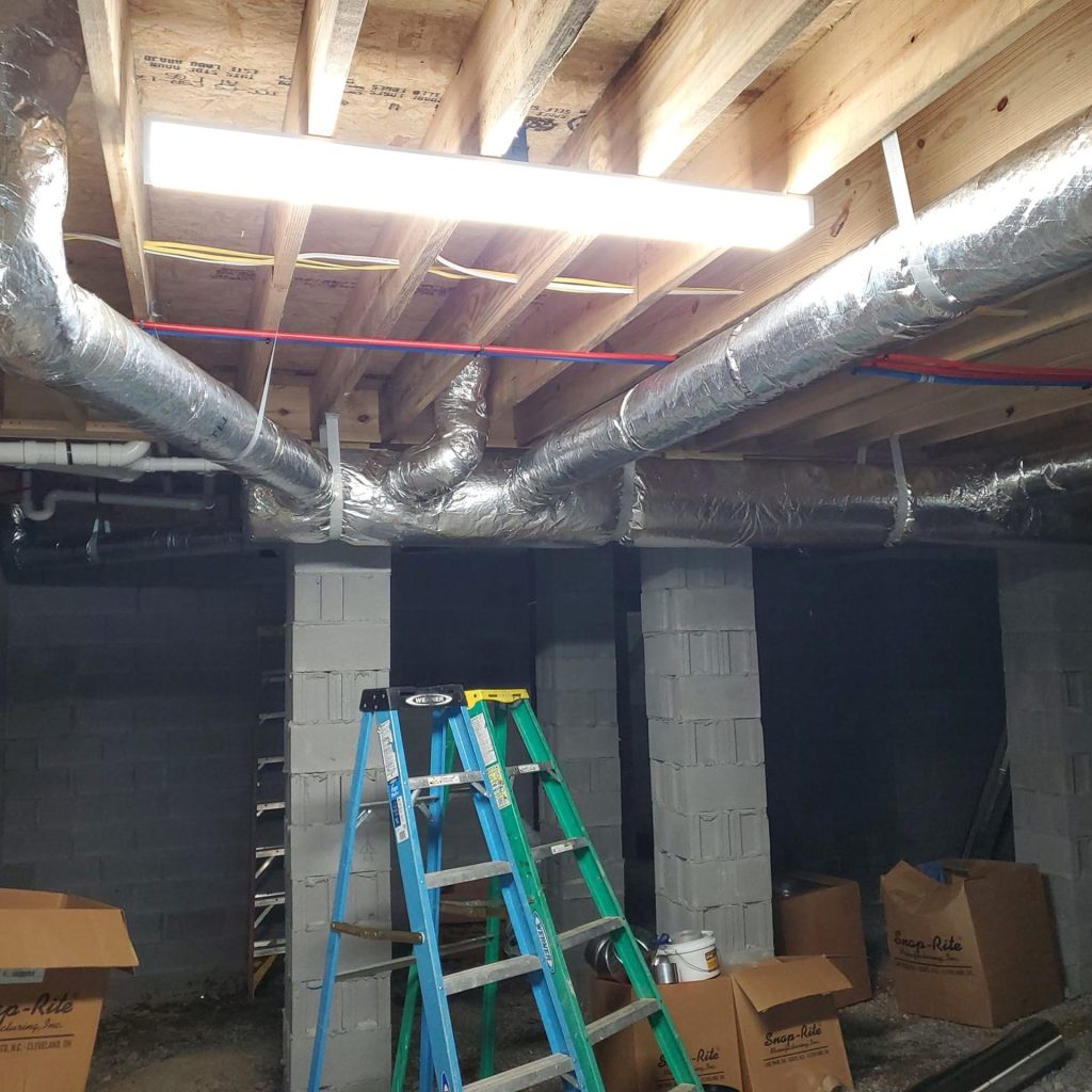 Insulated flex ductwork installed in an unfinished basement